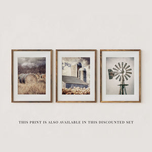 The image is a set of four framed pictures, each depicting different scenes related to agriculture and farming. The first picture shows a field of hay bales, the second picture features a windmill, the third picture shows a barn, and the fourth picture depicts a field of crops.