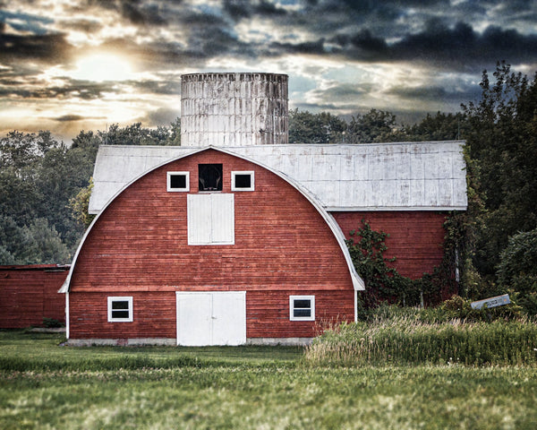 Red Oval-Shaped Barn at Sunset